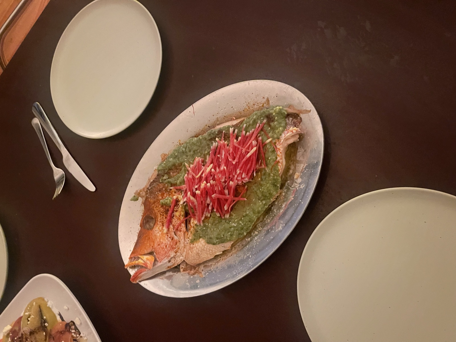Whole roasted snapper with salsa verde and red julienne